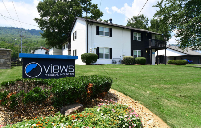 an image of the views apartments sign in front of the building