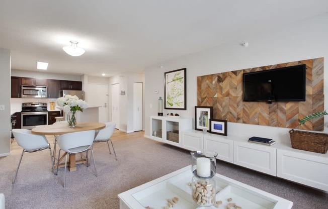 a living room with a table and a television
