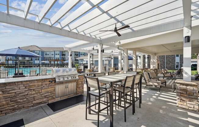 the preserve at ballantyne commons clubhouse with a bar and tables with chairs