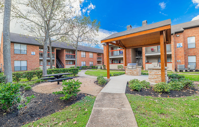 A residential area with apartment buildings and a covered walkway.