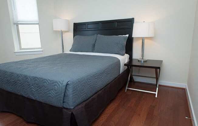 a bedroom with a bed and a nightstand