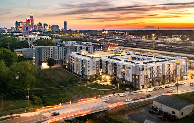 an aerial view of an apartment complex with the minneapolis skyline in the background  at Abberly Noda Vista Apartment Homes, Charlotte, NC