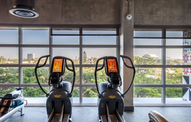 Fitness center with bikes at a rental community in Miami.