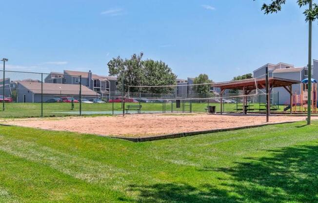 sand volleyball court at Cherry Hills Apartments