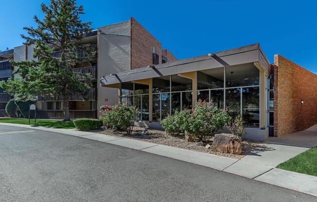 Villa Apartments leasing office with green plants