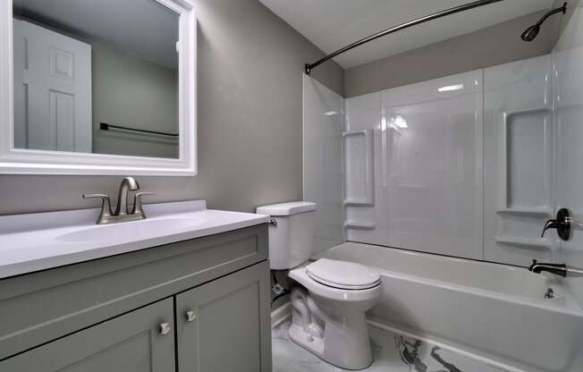 a bathroom with a toilet sink and bathtub