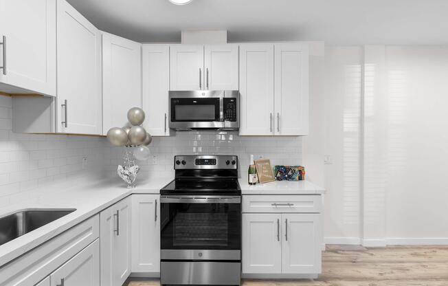 a stove top oven sitting inside of a kitchen