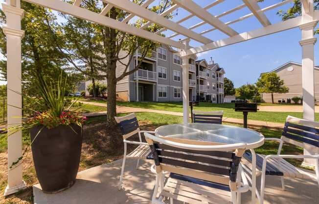 This is a photo of BBQ/Picnic area & sand volleyball courtat Trails of Saddlebrook Apartments in Florence, KY.