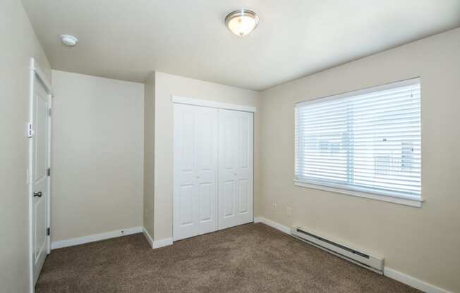 a room with carpet and a window and a door at Madison Park, Bozeman, MT, 59718