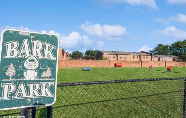 a bark park sign in apartment complex