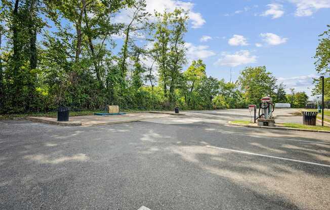 A roundabout with trees and a blue sky in the background.