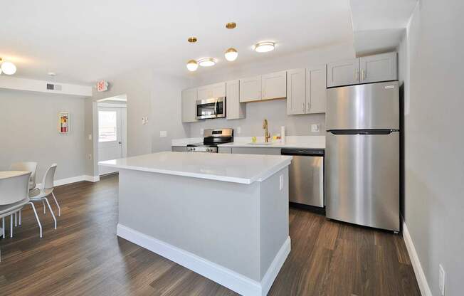 Resident clubhouse with fully equipped stainless steel appliances kitchen Warren Woods Apartments in Warren, MI.
