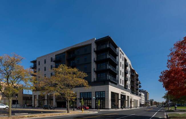 A modern multi-story building with a black and white exterior.