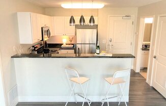 White cabinetry at Studio One Apartments, Michigan, 48201