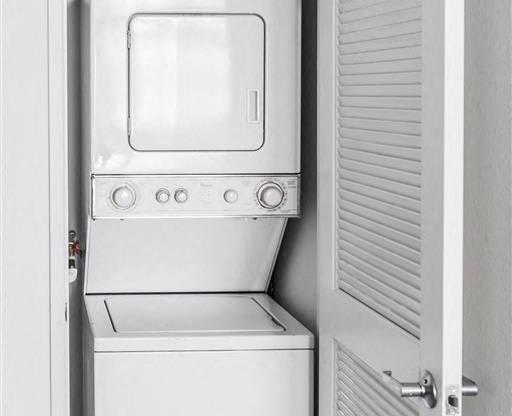 a refrigerator and a washing machine in a closet