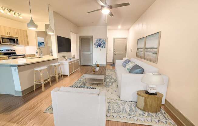 A modern living room with a white sofa and a wooden coffee table.