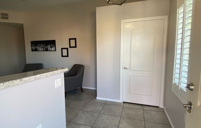 BEAUTIFUL CONDO IN A GATED COMMUNITY FEATURING PLANTATION SHUTTERS, TILE FLOORING AND NEW PAINT THROUGHOUT!