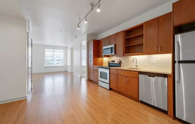 12 South Apartments - Nashville TN - kitchen with dark wood cabinets and stainless steel appliances