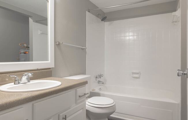 a bathroom with a sink toilet and bathtub