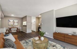 A living room with a brown couch and a coffee table.