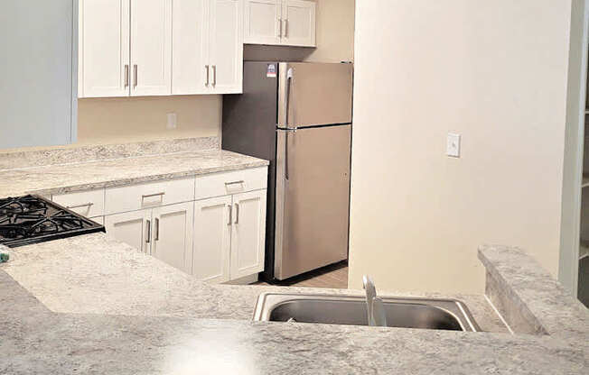 kitchen with stainless steel appliances at Emerald Park Apartments in Kalamazoo, Michigan