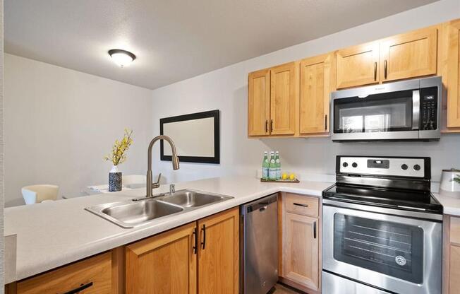The Crossings at Chapel Hill Kitchen with Dishwasher and View into Dining Room