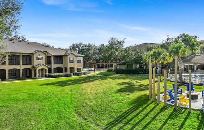 the backyard of a house with a yard and a pool