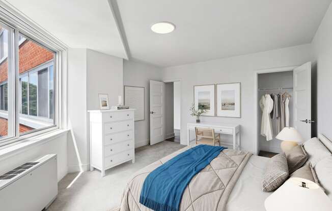 a bedroom with a bed and a dresser