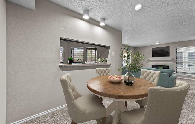 a dining room with a table and chairs