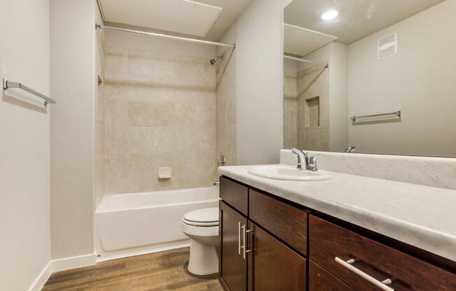 Bathroom with Vanity Lights at Aviator at Brooks Apartments, Clear Property Management, Texas, 78235