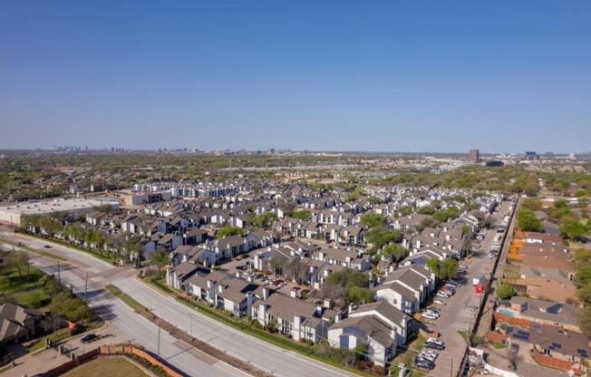 an aerial view of a neighborhood of houses in a city