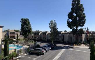 Front half of Sturbridge with the pool and guest parking