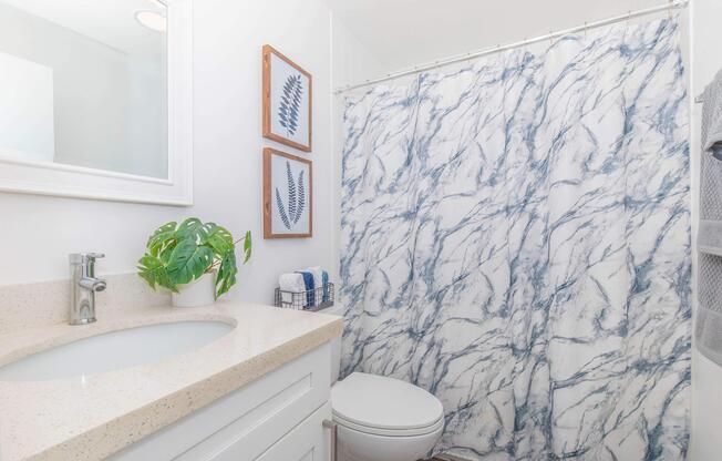 a room with a sink and a mirror