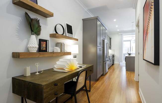 A modern kitchen with a wooden table and chairs.