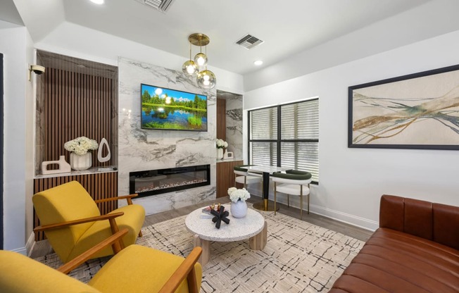 a living room with yellow furniture and a fireplace