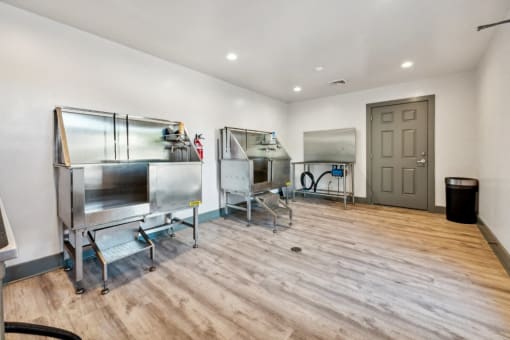 a tasting room with three refrigerators and a door