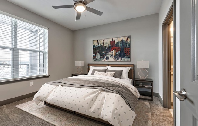 a bedroom with a bed and a ceiling fan