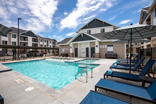 Swimming Pool Area With Shaded Chairs at Connect at First Creek, Denver, 80249