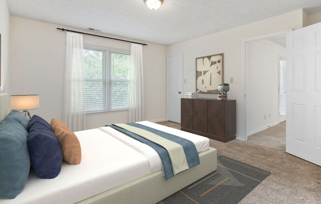 a bedroom with a bed and a dresser