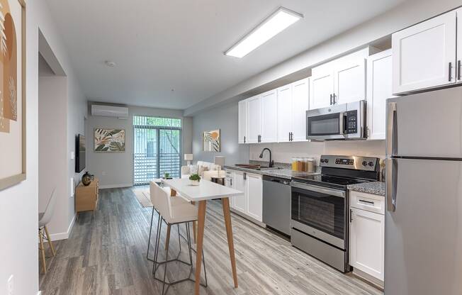 a kitchen and dining area in a 555 waverly unit