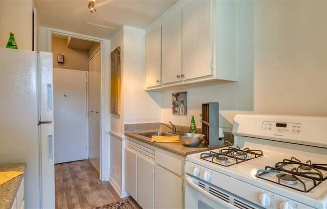 Kitchen with white fixtures at The Lafayette, Norfolk, Virginia