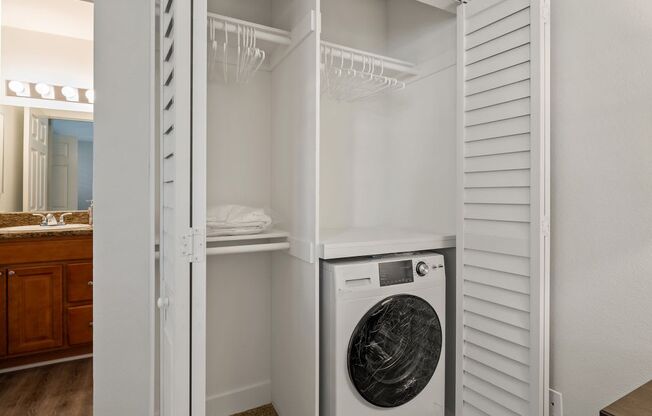a small laundry room with a washer and dryer