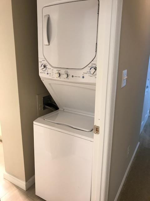 a white washer and dryer in a small closet