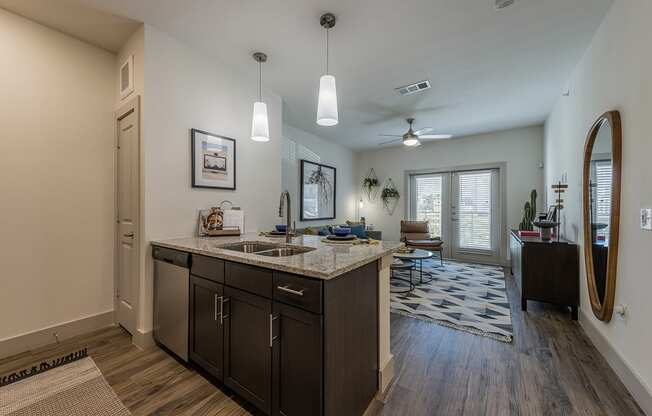 A kitchen with a sink and a counter.