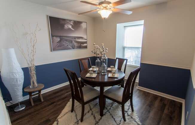This is a picture of the dining room in an upgraded 980 square foot, 2 bedroom, 1 bath model apartment at Fairfield Pointe Apartments in Fairfield, Ohio.
