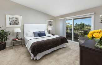 Bedroom with sliding glass doors to balcony