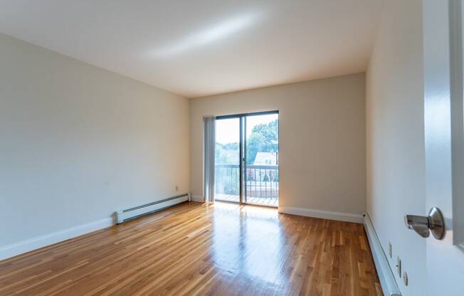 hardwood flooring and balcony slider door