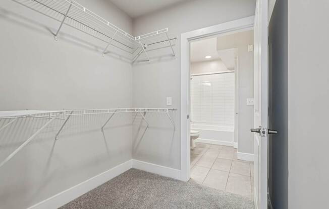 A super large spacious closet. a large, high ceiling, apartment that has two floors, is a modern loft, and in atlanta