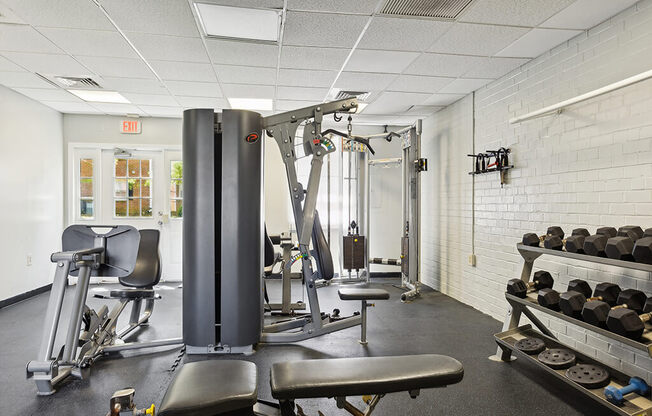 a gym with weights and other equipment in a building