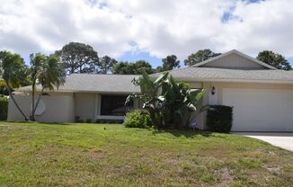 Centrally located 3 bedroom 2 bath home with in a nice tropical setting